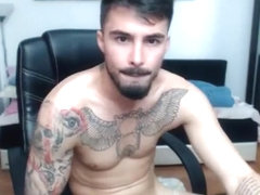 Sexy tattooed guy cum on cam