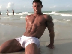 Handsome hot bodybuilder beach