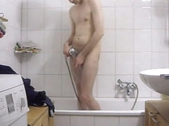 A hidden camera in the mirror and son is taking a shower