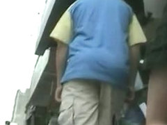 Enticing ass in a short skirt on an upskirt spy cam video