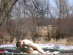 American brunette girl has sex with her bf on a trampoline