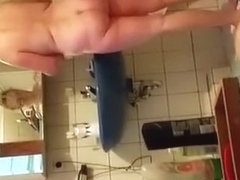 Man in bathtub films chubby woman