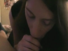 Brunette girl, wearning cat ears, sucks her bf pov on the bed.