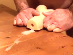 Precum fucking a very tight rubber pussy and a lot of cum
