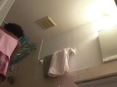 Sexy black girl caught nude in her own bathroom by a spy cam