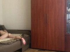 A young girl walks around the house naked without clothes