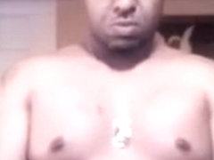 sexy black man puts on lotion