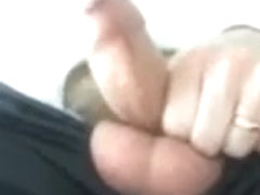 Dad stroking uncut cock at work