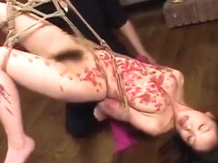 Delicate Japanese gal drenched in hot wax