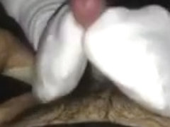 Teasing socked footjob