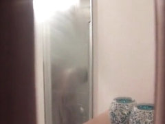 Sexy house guest spied in the shower