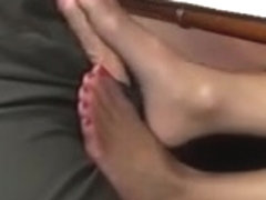 Footjob under the Table