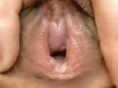 Closeup of girl playing with her pussy