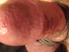 Stroking my tied and leaking cock