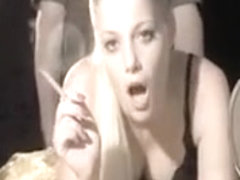 Busty young blonde gets banged hard while smoking a cigaret