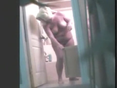 Chubby amateur gets clean in voyeur shower video