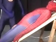 Superhero attired studs sucking cock