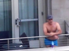 Sexy guy at the hotel balcony