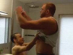Giant muscle man shower with tiny small guy