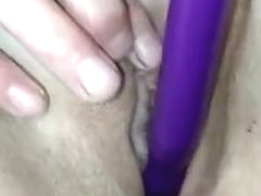 wife masturbates and puts a vibrator into her shaved pussy