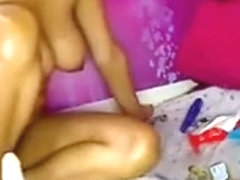 Latina Plays With A Toy