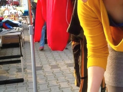 Street market seller has her big cleavage caught on the camera