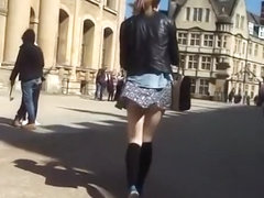 Wind lifts teen short skirt and exposes her ass