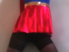 Teen Superwoman tied to the wall