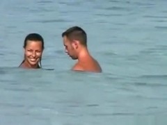 Voyeur tapes a girl sucking her bf's cock on a nude beach