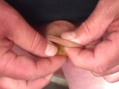 Chocolate coins (11) in foreskin