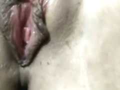 Wife caresses her tender pussy