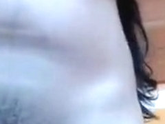 Brunette Xiomysex plays with her tits