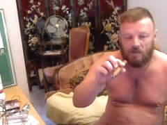 Bear smoking cigar, showing thick pierced cock