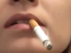 Pretty girl smoking very close-up lips and nails