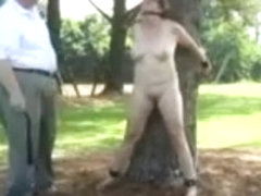 Woman tied to tree for light bondage