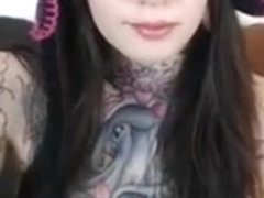 cute tattooed brunette hair shows her large scoops and love tunnel