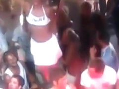 German girls dance in bikini on tables in a bar and flash their tits