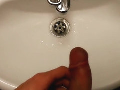 Pissing and jerking off in a public toilet