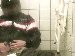 SHOWERING IN BOMBER HELMET AND PVC JACKET