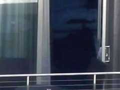 Sexy guy at the hotel balcony