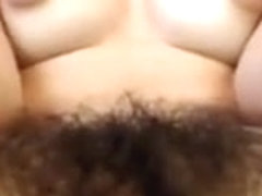 Hairy gal, puffy nips  fingering pussy